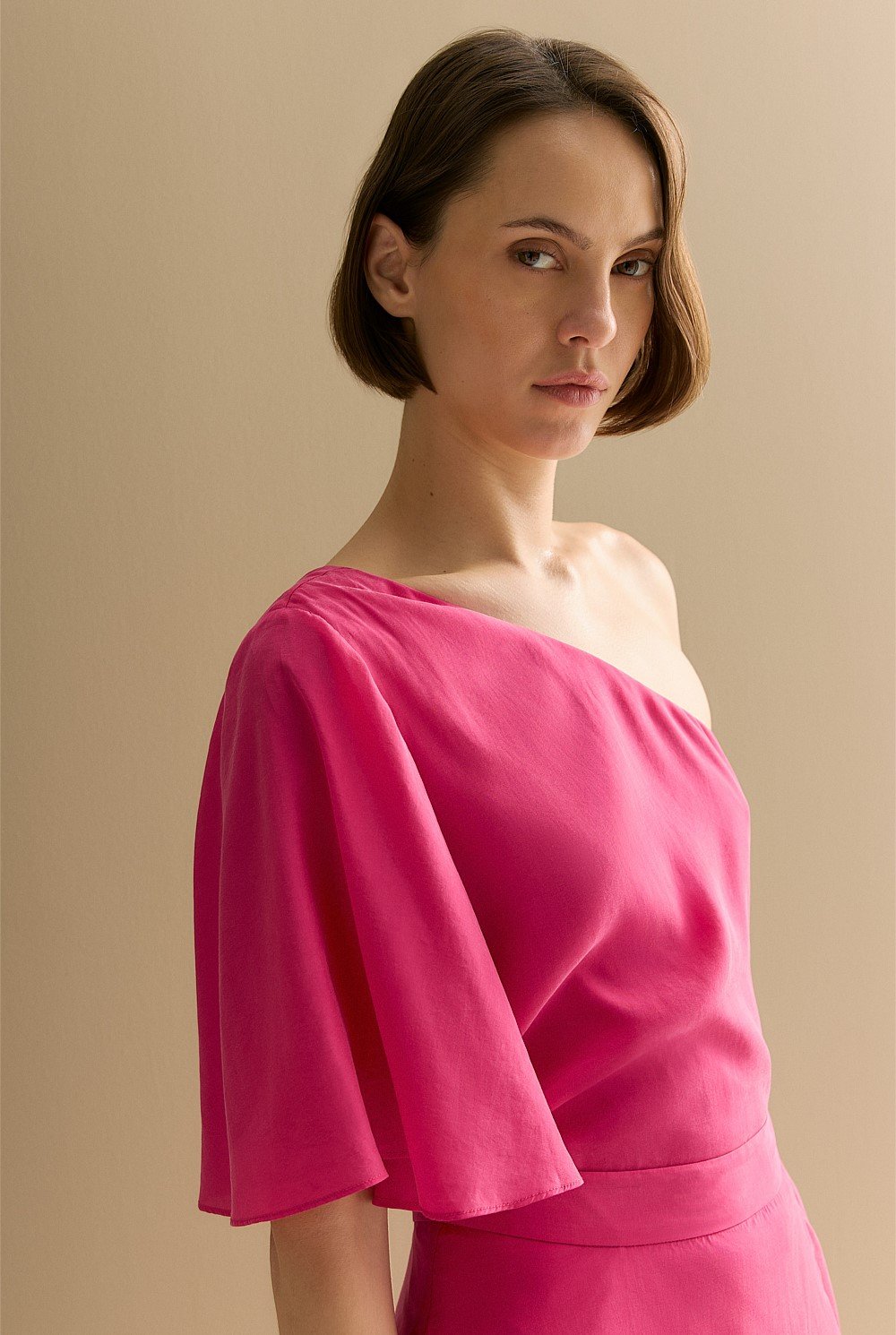 Asymmetric Sleeve Draped Top